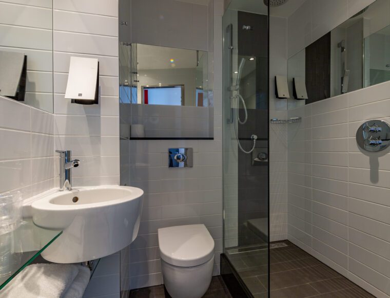 A bathroom with a large walk-in shower.