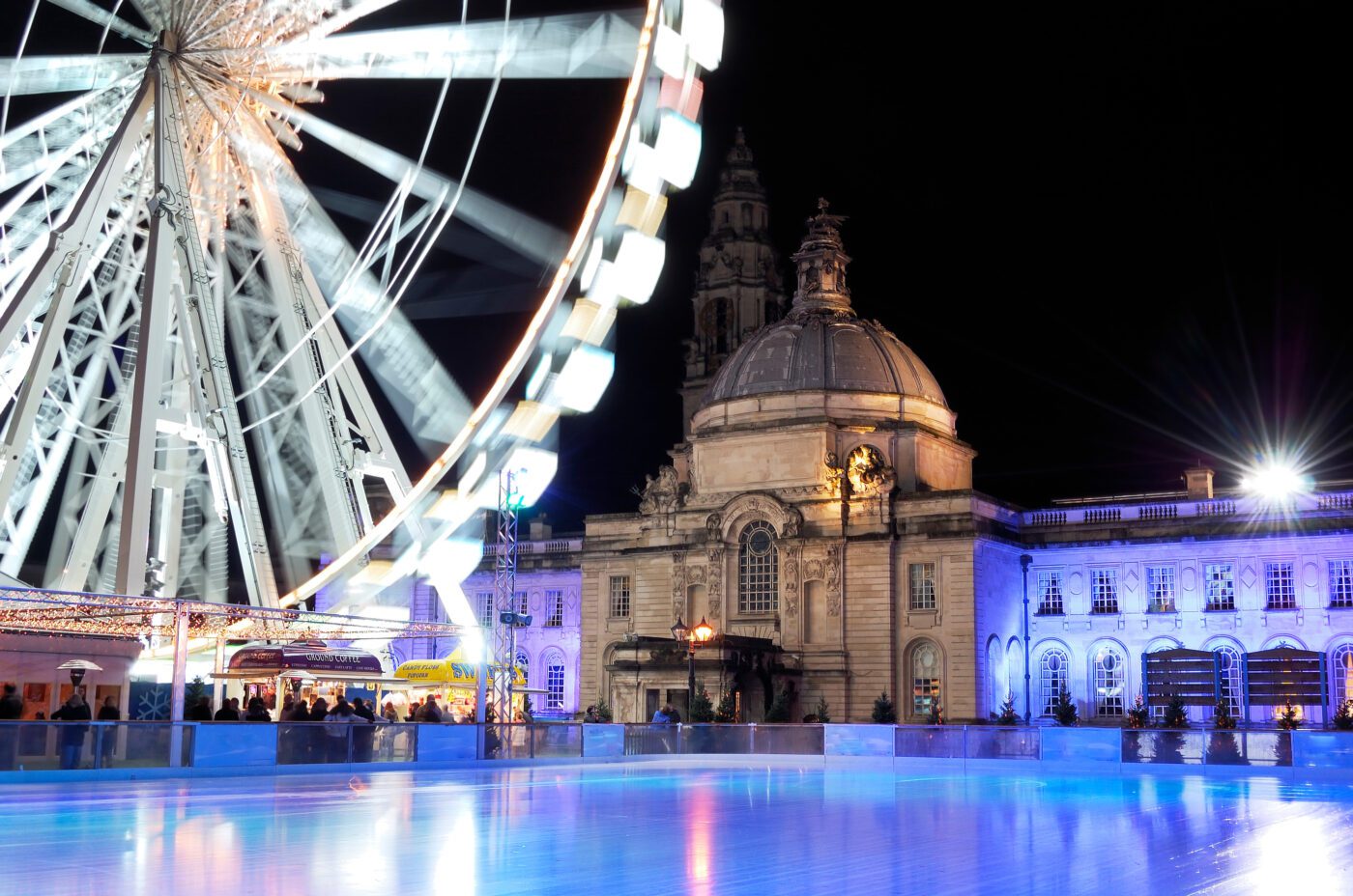 An empty Ice rink and winter wonderland Cardiff. City Hall in background.